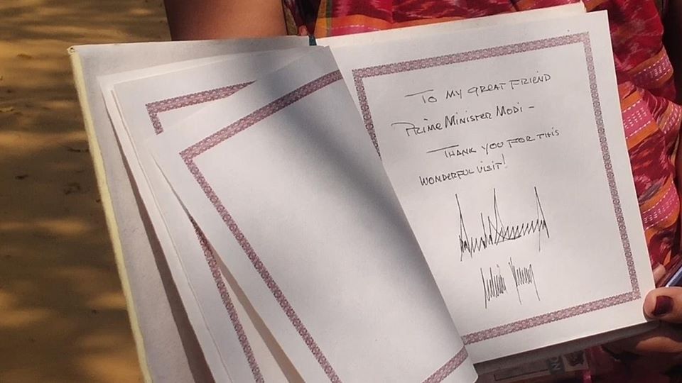trump written on visitors book